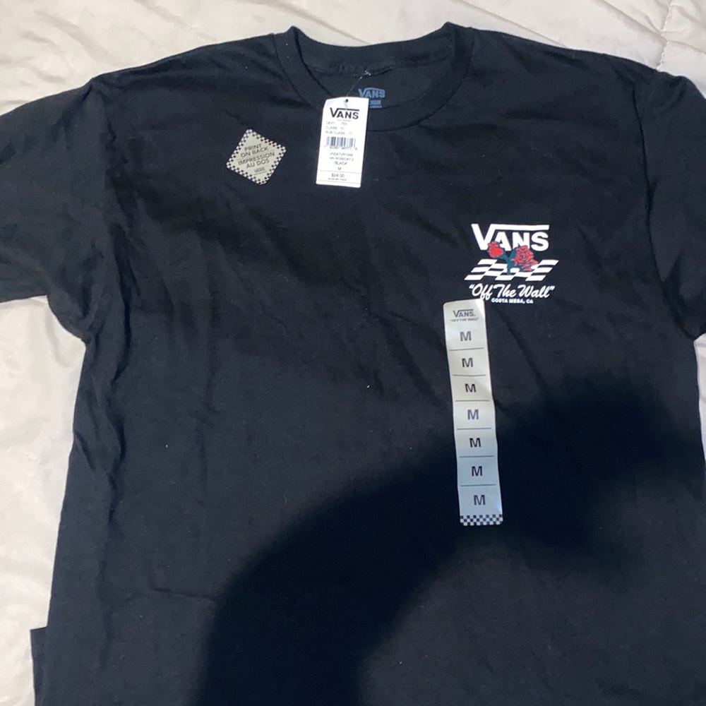 Van’s black shirt